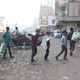 Young boys searching for valuable metal components they can sell in Seelampur.